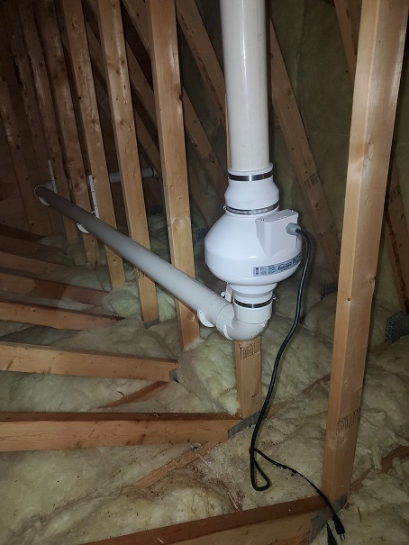 Radon fan in the attic through the roof installation project